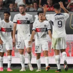 PSG emerges victorious in Ligue 1 match, which is abruptly halted due to a firecracker incident targeting the goalkeeper.